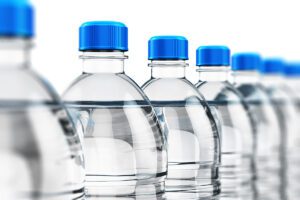 Row of plastic drink water bottles.