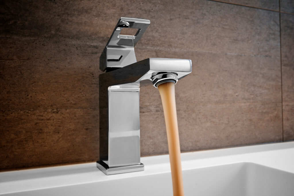 faucet running brown water 