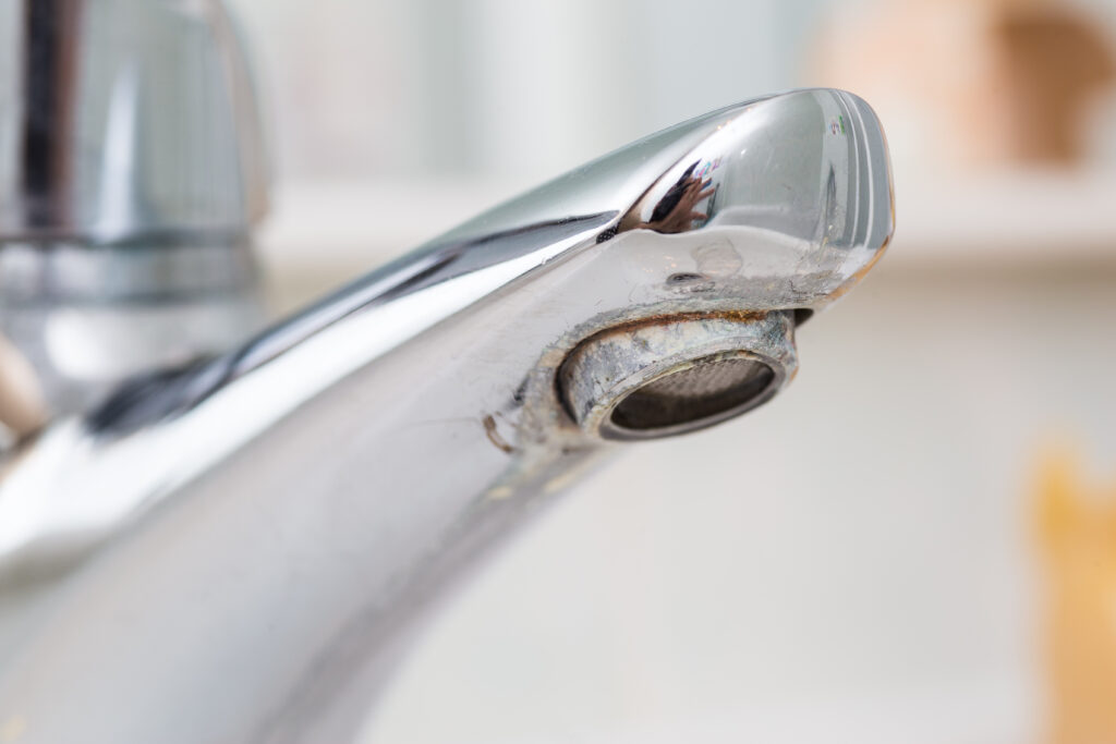 sink faucet with limescale buildup